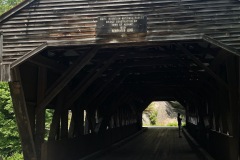 The sign hanging over the bridge
