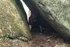 Crawling through one of the caves