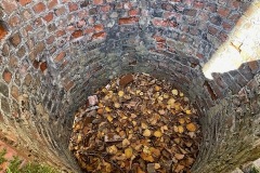 A cylinder of bricks that looks like a chimney