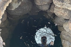 Looking into the well.